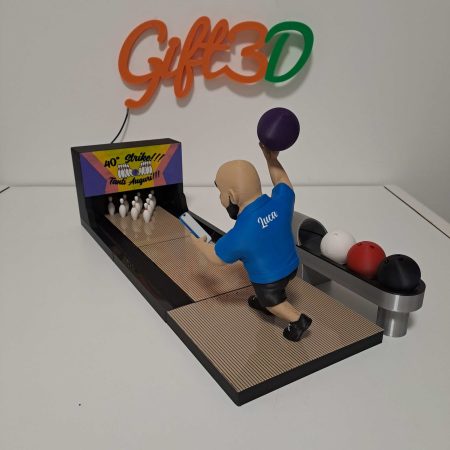 Mini bowling game with figurine and colorful balls for fun.